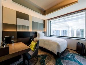 Postel nebo postele na pokoji v ubytování Pullman Tokyo Tamachi