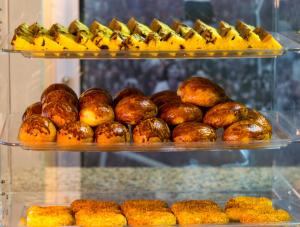 a display case filled with lots of different types of food at VOLLEY HOTEL ANKARA in Ankara