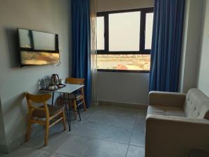 a living room with a couch and a table at Residence 110 (Hotel and Apartments) in Phnom Penh