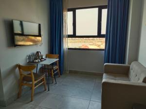 a living room with a couch and a table at Residence 110 (Hotel and Apartments) in Phnom Penh