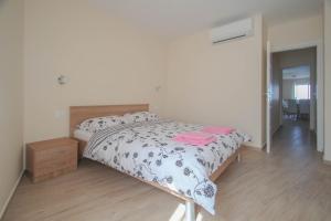 Giường trong phòng chung tại Villa Bonazza