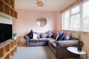 a living room with a couch and a tv at Banchory House - SJA Stays - 2 Bed Apartment in Banchory