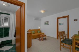 a living room with a couch and a table at Villa Juric 2 in Baška Voda +94 photos