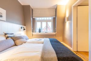 Postel nebo postele na pokoji v ubytování Logierhaus K15 Appartement 11 Plus