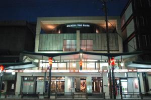 a store front at night with red traffic lights at Kizashi The Suite 京都祇園 in Kyoto