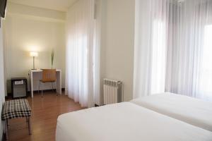 Postel nebo postele na pokoji v ubytování Hotel Delta