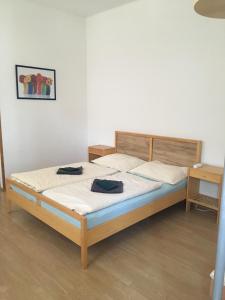 Postel nebo postele na pokoji v ubytování Penzion nad Bankou
