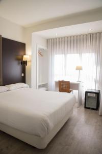 Postel nebo postele na pokoji v ubytování Hotel Delta