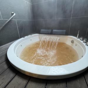 Ванная комната в プラフィーノリゾートヴィラ +34 фотографии