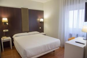 Postel nebo postele na pokoji v ubytování Hotel Delta