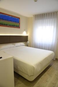 Postel nebo postele na pokoji v ubytování Hotel Delta