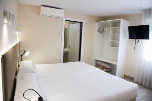 Postel nebo postele na pokoji v ubytování Hotel Delta