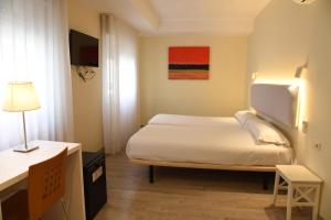 Postel nebo postele na pokoji v ubytování Hotel Delta