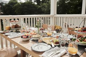 a table with plates of food on top of a table at The Cozy Hotel & Lofts Timmendorfer Strand in Timmendorfer Strand