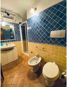 a bathroom with a toilet and a sink at SOLEMARE in Palau +17 photos