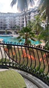 a view of a swimming pool from a balcony at CAMELIA HOLIDAY APARTMENT in Kuah