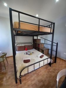 a bedroom with two bunk beds in a room at Jessica Flat GuestHouse , Holiday and Business in Cospicua