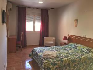 Posteľ alebo postele v izbe v ubytovaní Hotel Godofredo