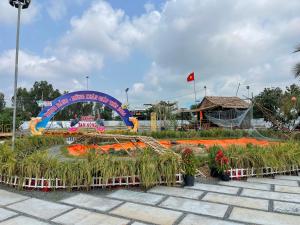 a display of plants in a park with a sign at VIEW HOTEL-TRÀM CHIM in Tràm Chim