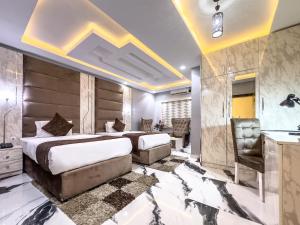 Postel nebo postele na pokoji v ubytování Parkview Astoria Hotel + 37 fotografií