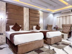 Ένα ή περισσότερα κρεβάτια σε δωμάτιο στο Parkview Astoria Hotel