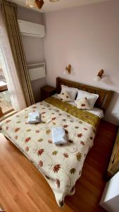 Ένα ή περισσότερα κρεβάτια σε δωμάτιο στο Belvedere Holiday Club SPA&SKI private apartments