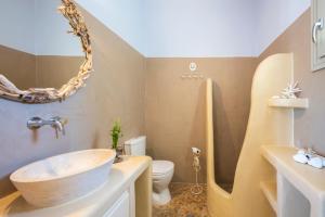 a bathroom with a sink and a toilet at Princess Sofia Luxury Villa (with private pool) in Kampos Paros
