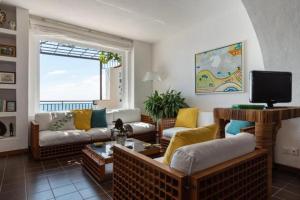 Et opholdsområde på Villa Sea view on the rocks