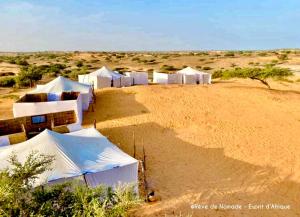 a group of tents in the desert at Camp Rêve de Nomade in Lompoul
