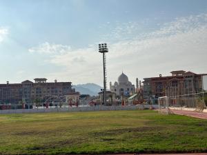 a city with a soccer field in front of buildings at Porto Sharm 2024 in Sharm El Sheikh