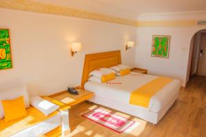 Ένα ή περισσότερα κρεβάτια σε δωμάτιο στο Hotel Timoulay and Spa Agadir