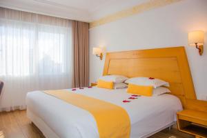 Ένα ή περισσότερα κρεβάτια σε δωμάτιο στο Hotel Timoulay and Spa Agadir