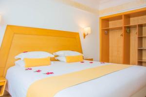 Ένα ή περισσότερα κρεβάτια σε δωμάτιο στο Hotel Timoulay and Spa Agadir