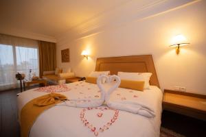 Ένα ή περισσότερα κρεβάτια σε δωμάτιο στο Hotel Timoulay and Spa Agadir