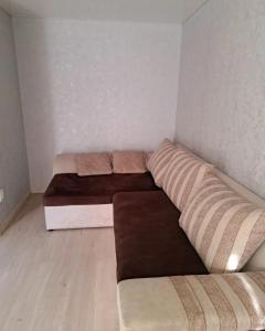a small room with two beds in it at Студия 2 комнаты в центре города in Kryvyi Rih