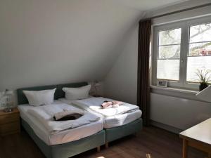 Postel nebo postele na pokoji v ubytování Gaestehaus _ Strandhalle
