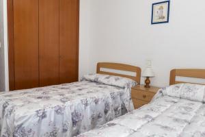 Posteľ alebo postele v izbe v ubytovaní Florazar 2, Vii-2-A
