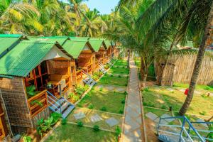 an aerial view of a resort with palm trees at Agonda Serenity Resort in Agonda