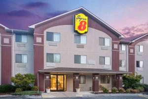 a hotel with a sign on the front of it at Super 8 by Wyndham Lynchburg VA in Lynchburg