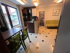 a view of a kitchen and a living room at Botabara 312 Self Catering Beach Apartment in Pomorie