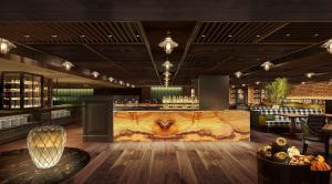 a restaurant with a bar with a large marble counter at Grand Hyatt Singapore in Singapore