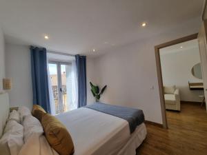 Postel nebo postele na pokoji v ubytování APARTAMENTOS SAN ANDRES