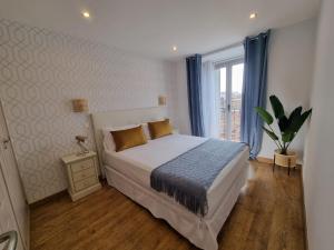 Postel nebo postele na pokoji v ubytování APARTAMENTOS SAN ANDRES