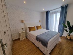 Postel nebo postele na pokoji v ubytování APARTAMENTOS SAN ANDRES