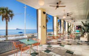 a restaurant with a view of the ocean at Barceló Benidorm Beach - Adults Recommended in Benidorm