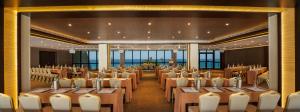 a banquet hall with tables and chairs in a room at Amathus Beach Hotel Limassol in Limassol +37 photos