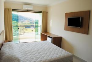 Cama o camas de una habitación en Carmen Palace Hotel