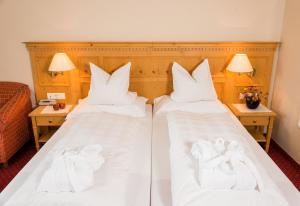 A bed or beds in a room at Hotel Regina