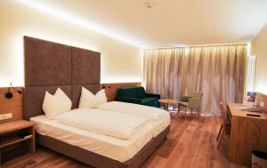 A bed or beds in a room at Hotel Regina