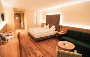 A bed or beds in a room at Hotel Regina